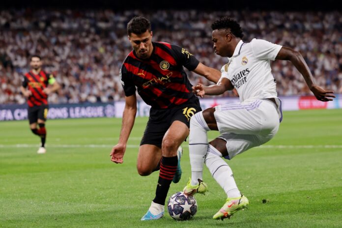idolo-do-manchester-united-afirma-que-rodri-e-melhor-que-vini-jr.