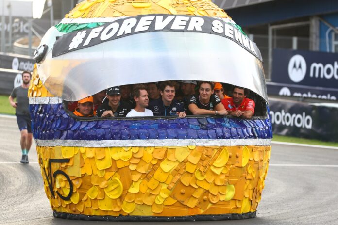 sebastian-vettel-participa-de-homenagem-a-senna-com-catadores-de-lixo