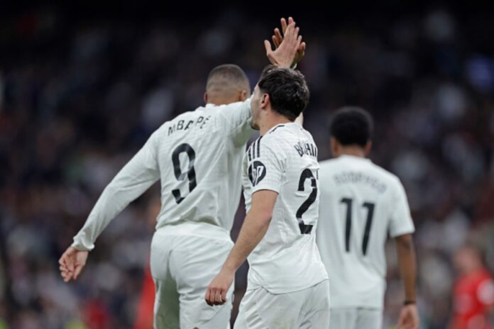 sem-vini-jr.,-real-madrid-vence-sevilla-e-encosta-no-lider-espanhol